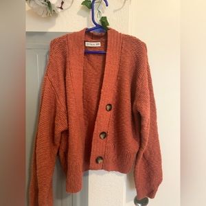 cropped orange cardigan